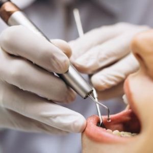 Dentist doing check up