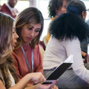 People chatting at a conference