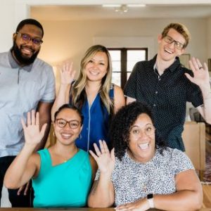 Group of 5 people waving
