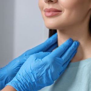 Patient having a examination of their glands in their throat